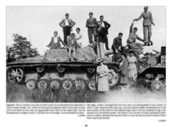 Civilians adorn a Sturmgeschütz